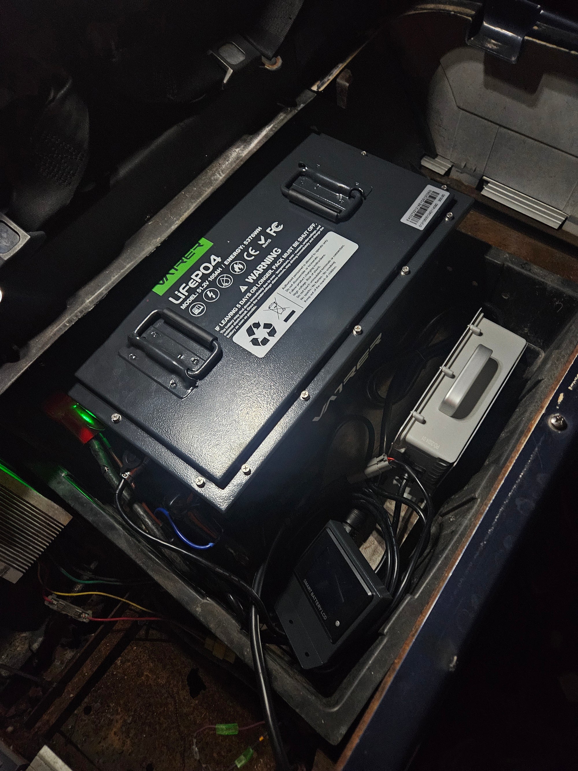 Users install the golf cart lithium battery into the EZ-GO 18