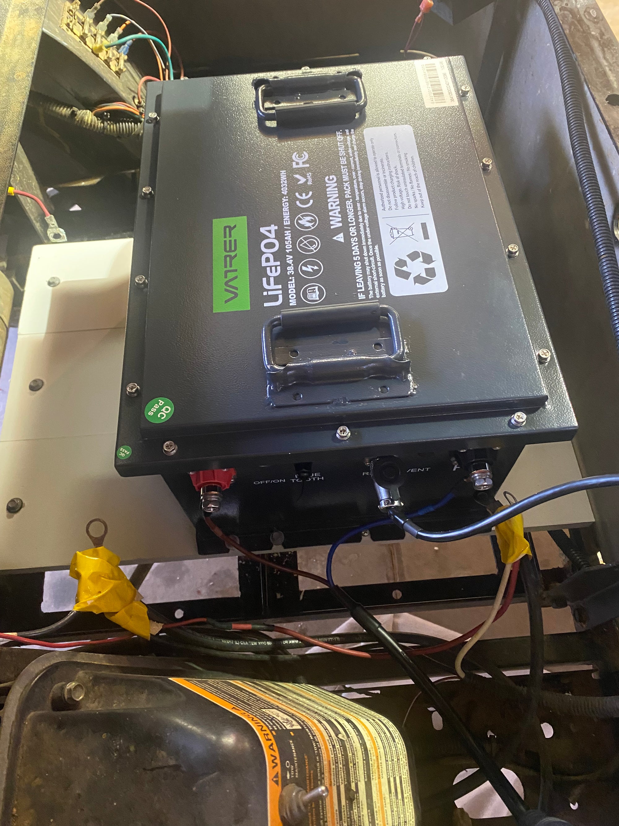 Users install the golf cart lithium battery into the Icon i40 golf cart 18