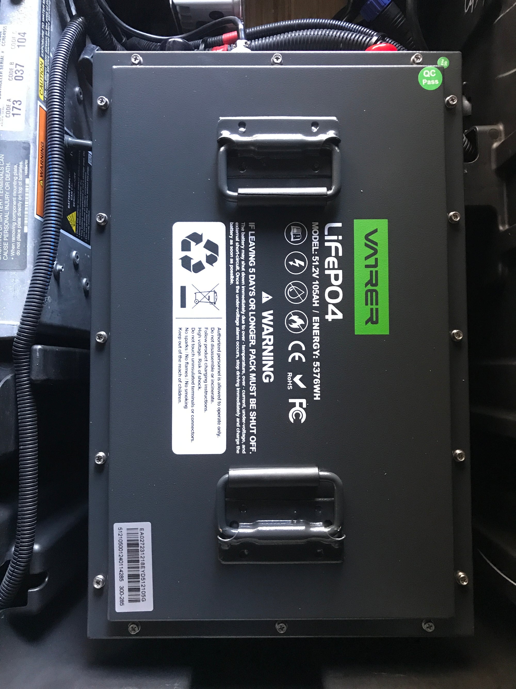 Users install the golf cart lithium battery into the Evolution electric golf cart 18