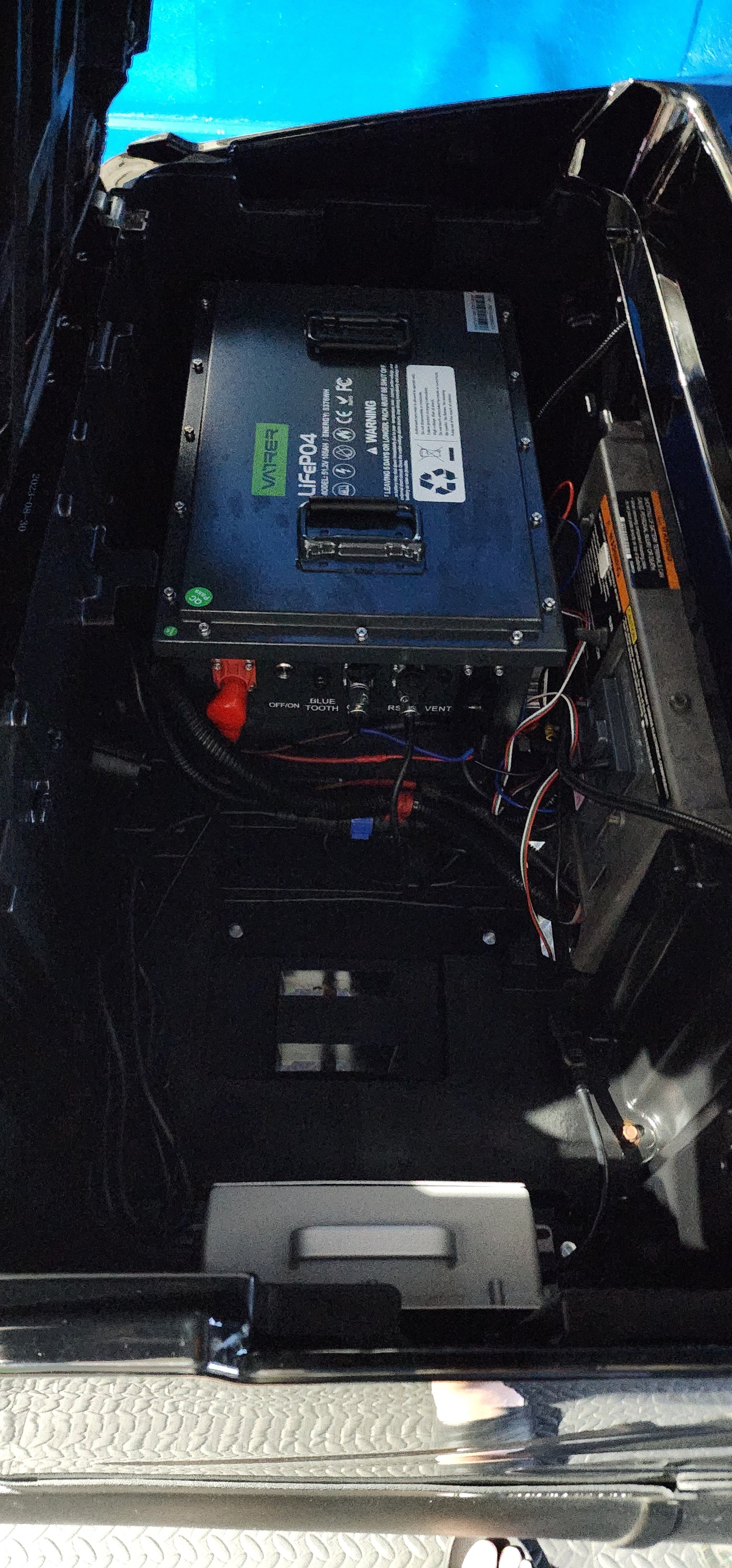 Users install the golf cart lithium battery into the Polaris GEM 17