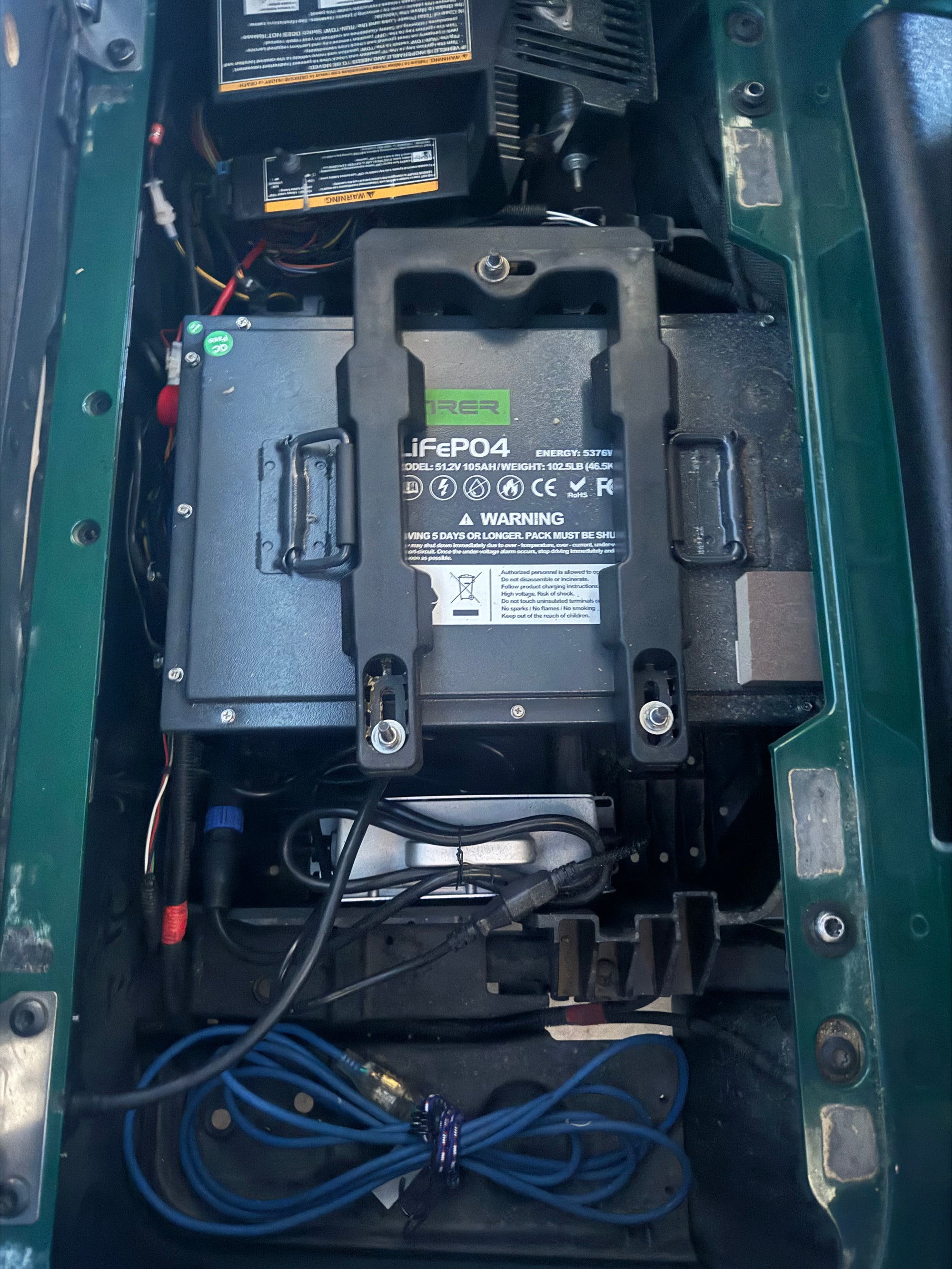 User installs golf cart lithium battery into Club Car 18