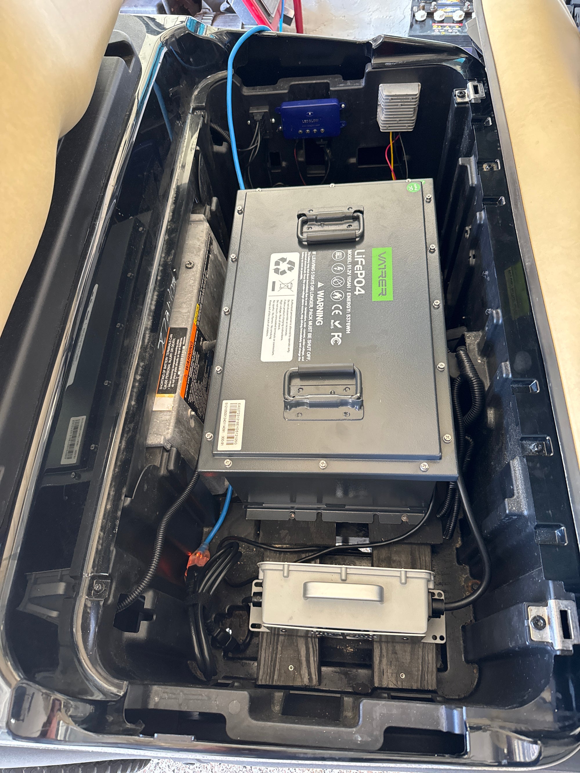 Users install the golf cart lithium battery into the Yamaha 18